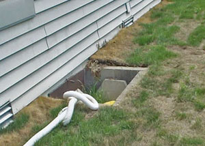 old concrete window well of a Warren crawl space