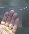 Closeup of a clear plastic covering on a Wellsville crawl space block wall