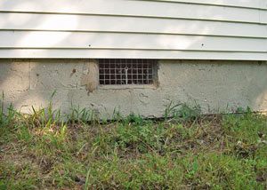 Open crawl space vents that let rodents, termites, and other pests in a home in Brookville