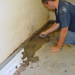 Testing a French drain system in a Wellsville home.