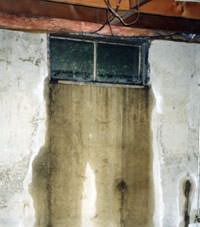 Flooding through basement windows in a Randolph home.