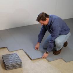 basement subfloor tiles being installed by a contractor in Port Allegany