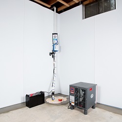 Sump pump system, dehumidifier, and basement wall panels installed during a sump pump installation in Ridgway