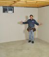 Bradford basement insulation covered by EverLast™ wall paneling, with SilverGlo™ insulation underneath