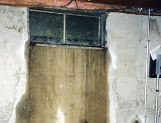 Water pouring out from a basement window in Oil City