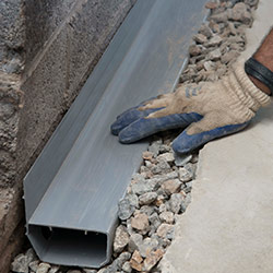 installing a drain tile system in a Cuba home